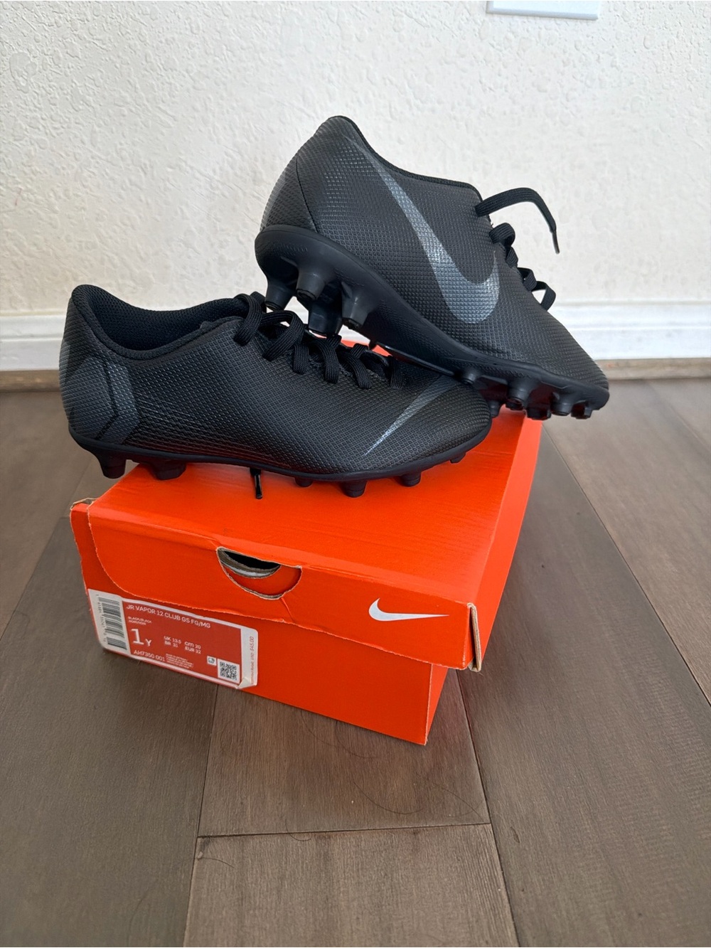 Nike Black Youth Soccer Cleats with Gray Swoosh